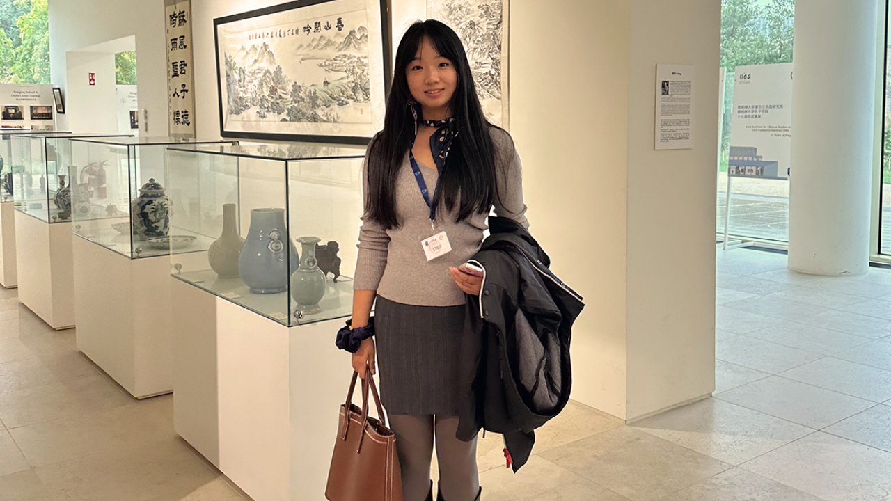 Global Study Program grad YiFei Li poses for a photo in a museum