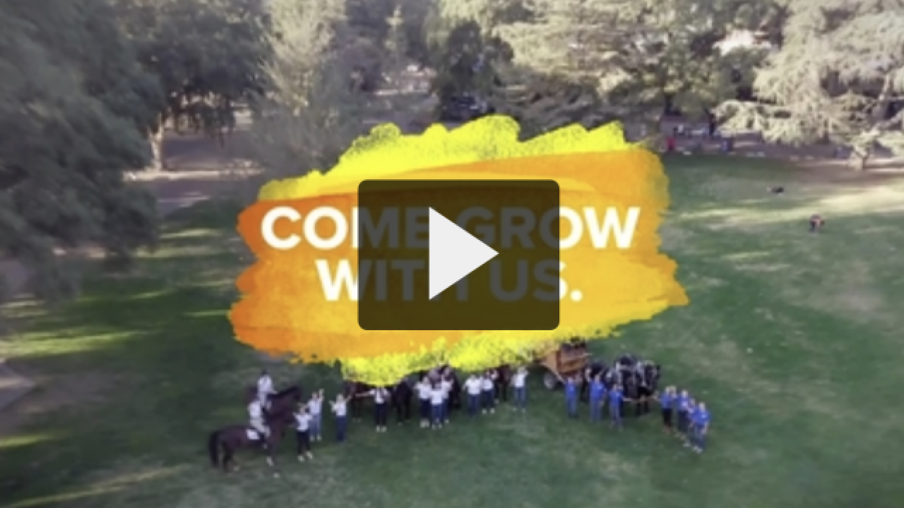 Screen shot of video play button over campus video