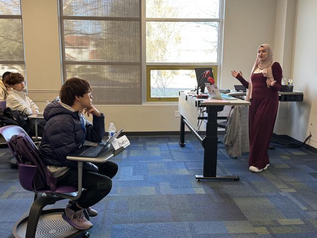 students listen to an instructor's lecture in the classroom