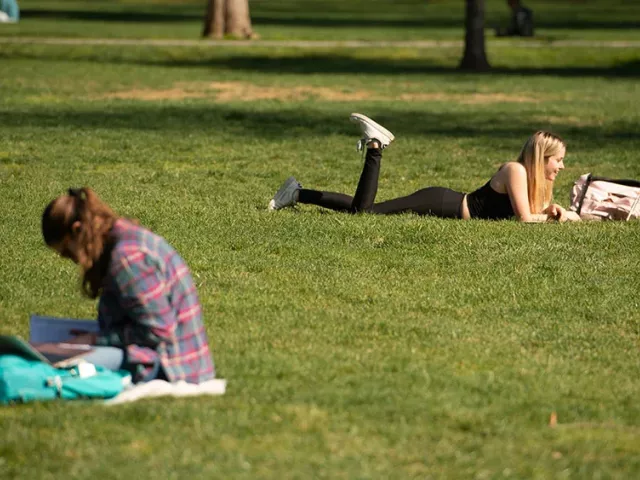 students study on uc davis quad