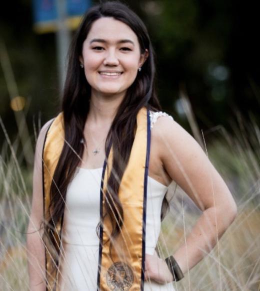Anmerlyn Tucker poses in grad attire