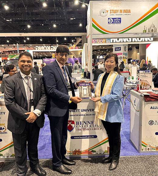 Representatives from Bennett University in India pose for a photo with Xin Chen at NAFSA 2025