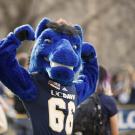 Gunrock poses for a photo at a pep rally during homecoming