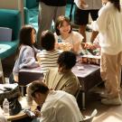 international students play games in the lobby of the UC Davis International Center