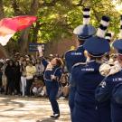 UC Davis Marching Band and flag bearer perform during Picnic Day