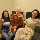 three Kazakh scholars pose for a photo during orientation at UC Davis