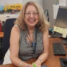 International Program Specialist Paula Khodaverdi sits at her desk