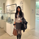Global Study Program grad YiFei Li poses for a photo in a museum