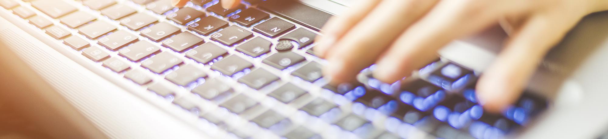 close up of person on laptop