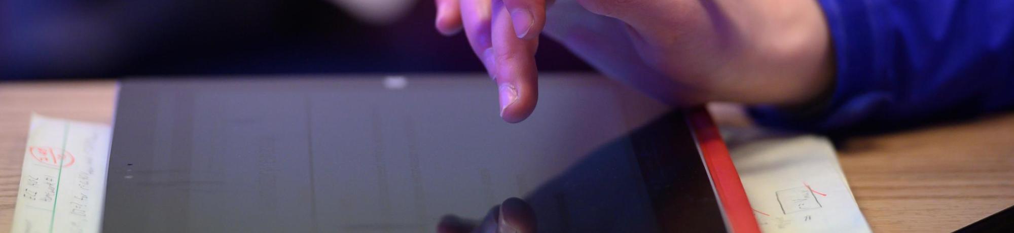 close up for person touch tablet screen