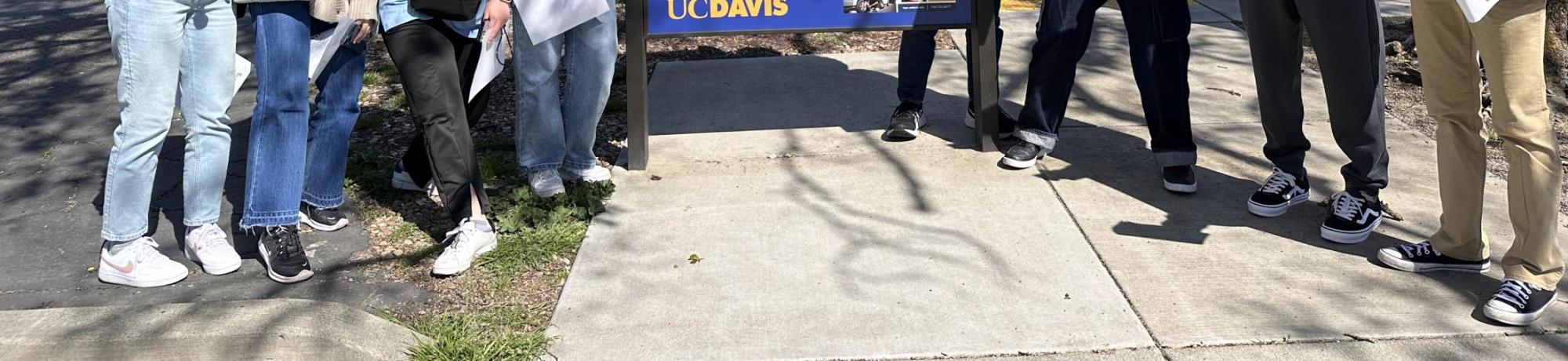Seikei High School students pose next to map of UC Davis
