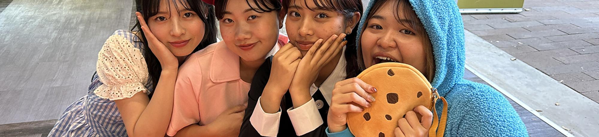 A group of UC Davis international students in costume pose during the annual Halloween Party.
